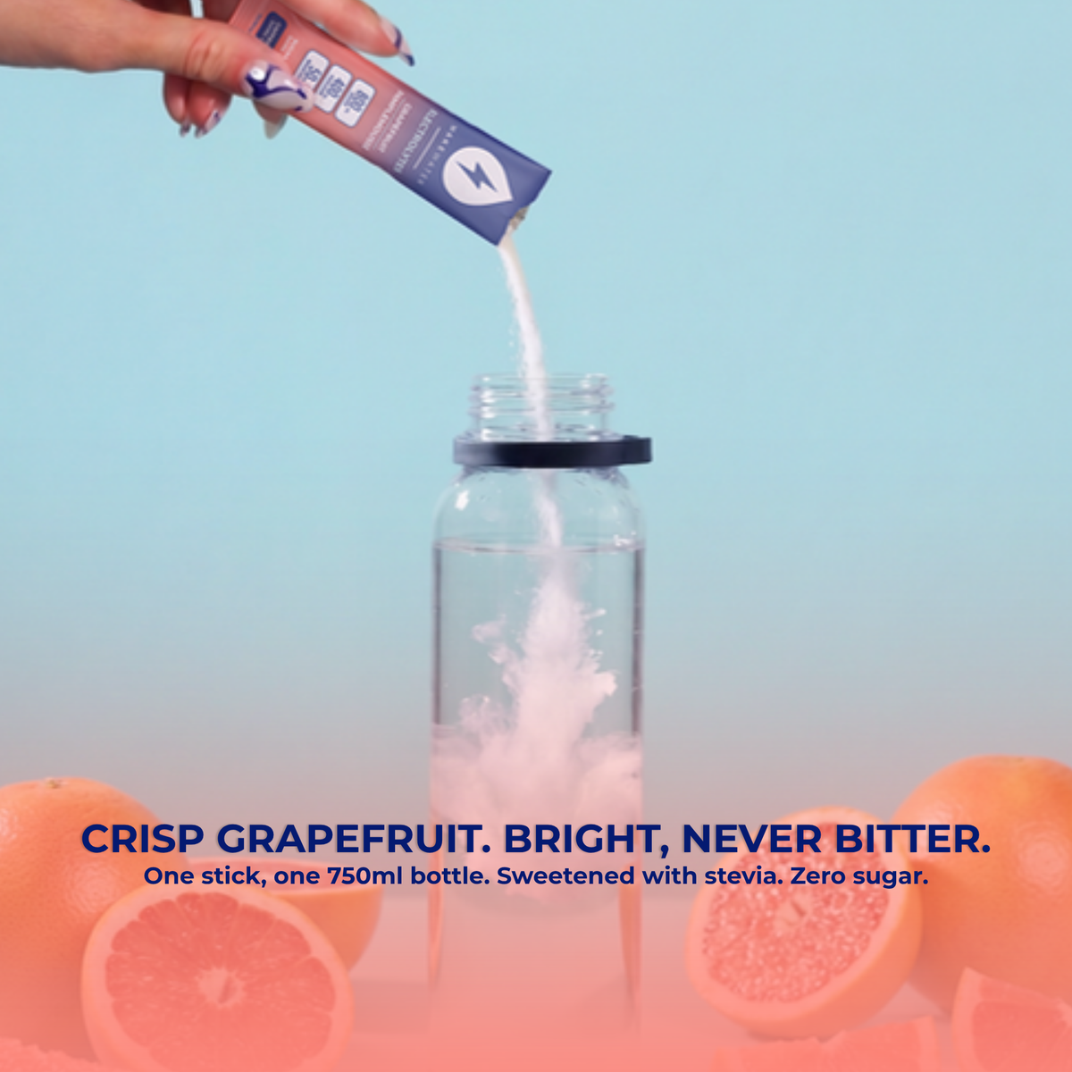 Grapefruit stick pouring into a water bottle